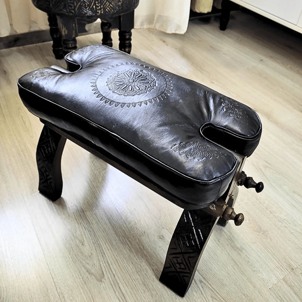 Black Moroccan Camel Saddle Stool, Genuine Leather Cushion and Solid Cedar Wood Carved Base. - JA ZWIIN